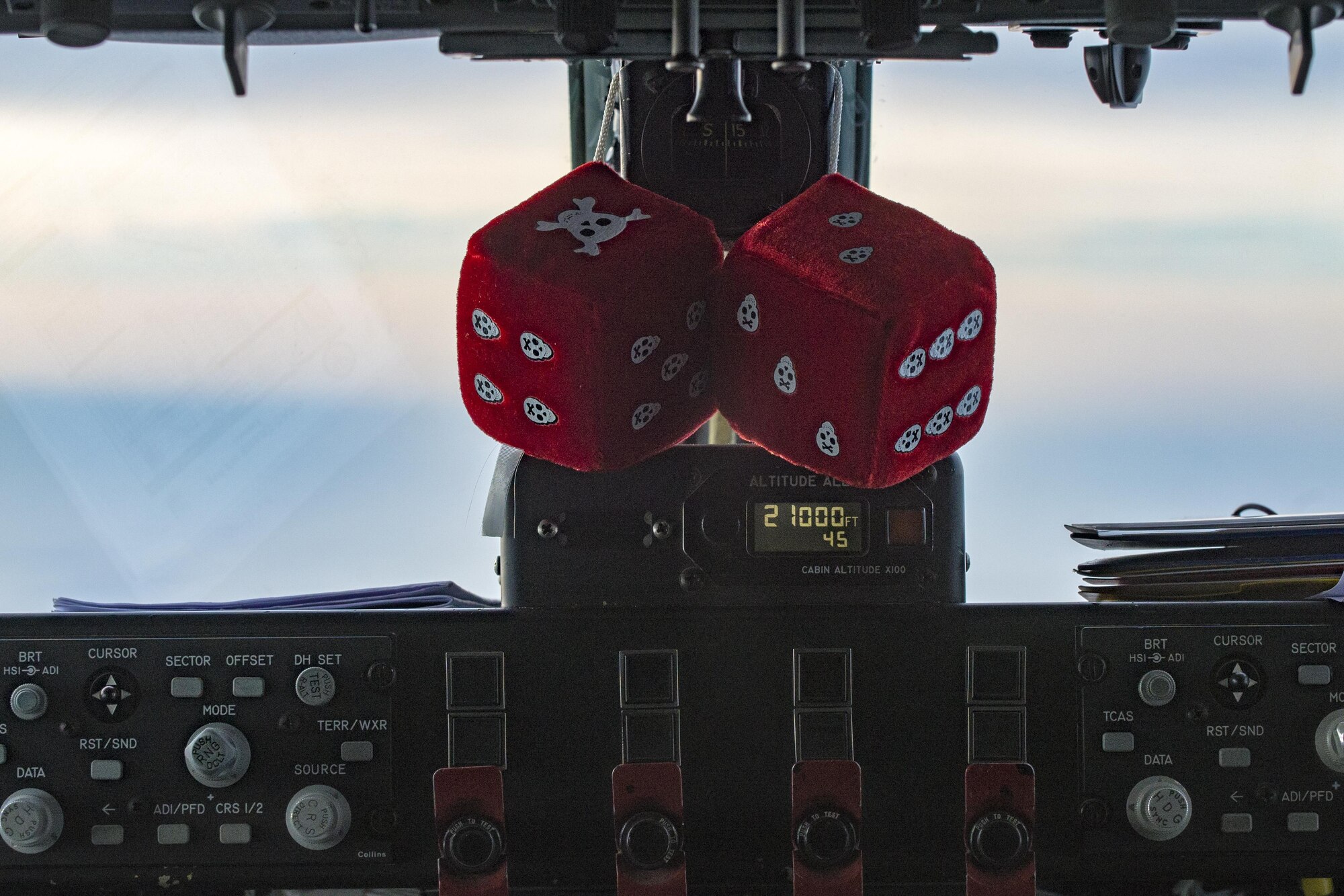 Fuzzy dice hang in the cockpit of a KC-135 Stratotanker assigned to Utah Air National Guard’s 191st Air Refueling Squadron during a two-week training on Oct. 26, 2016. The Utah ANG’s 191st ARS provided two refueling crews to support more than 200 combined 555th and 510th Fighter Squadron sorties. (U.S. Air Force photo by Airman 1st Class Cory W. Bush/Released)