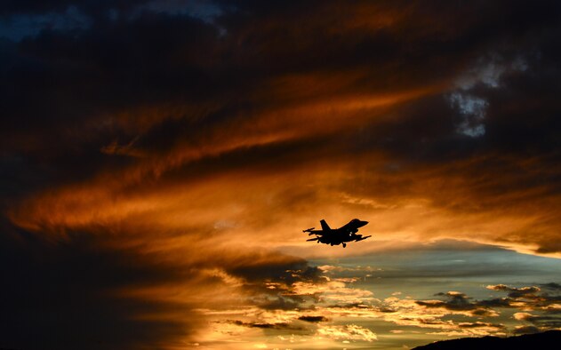 An F-16 Fighting Falcon flies over Aviano Air Base, Italy, Oct. 20, 2016. The 555th and 510th Fighter Squadrons deter aggression, defend U.S. and NATO interests, and develop Aviano AB through superior combat air power, support and training. (U.S. Air Force photo/Staff Sgt. Krystal Ardrey)