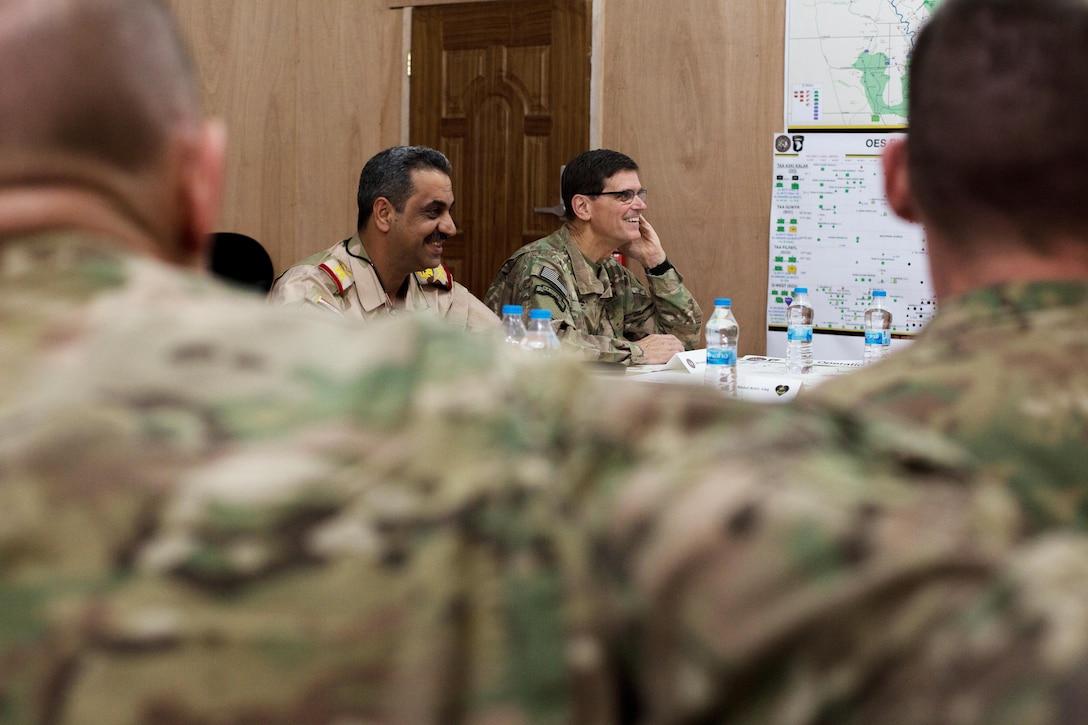 U.S. Army Gen. Joseph Votel, Commander of the United States Central Command, discusses battle plans with Iraqi security forces at Qayyarah West, Iraq, Oct. 25, 2016. More than 60 coalition partners have committed themselves to the goals of eliminating the threat posed by the Islamic State of Iraq and the Levant and have contributed in various capacities to the effort to combat ISIL in Iraq, the region and beyond.  (U.S. Army photo by Spc. Christopher Brecht)