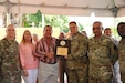 Mr. Carlos Lopez Rivera, Dorado city Mayor presents a plaque of appreciation to the 448th Engineer Battalion for their hard work and dedication. The US Army Reserve Soldiers assisted the community by renovation an old elementary school into a center for the Early Head Start Program. The inauguration of the 'Tesoro Infantil' took place on October, 26.