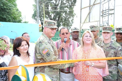 Col. John Simma, 210th Regional Support Command commander and Mrs. Edith Hunt de Lopez, Mr. Carlos Lopez’ wife, cut the ribbon as part of the inauguration of 'Tesoro Infantil' on October 26. The 448th Engineer Battalion renovated an old elementary campus to be used as an Early Head Start Center.