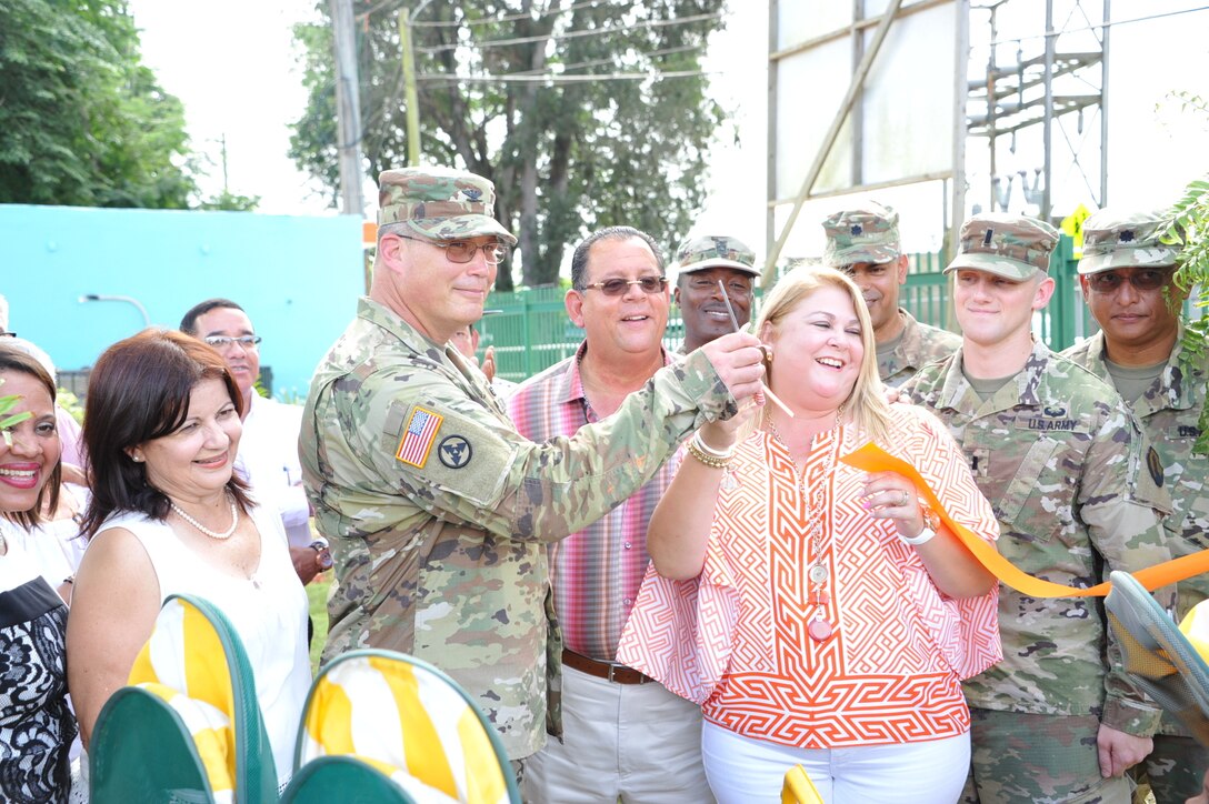Col. John Simma, 210th Regional Support Command commander and Mrs. Edith Hunt de Lopez, Mr. Carlos Lopez’ wife, cut the ribbon as part of the inauguration of 'Tesoro Infantil' on October 26. The 448th Engineer Battalion renovated an old elementary campus to be used as an Early Head Start Center.