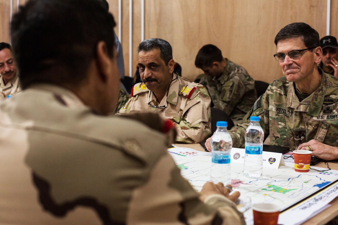 U.S. Army Gen. Joseph Votel, Commander of the United States Central Command, discusses battle plans with Iraqi security forces at Qayyarah West, Iraq, Oct. 25, 2016. More than 60 coalition partners have committed themselves to the goals of eliminating the threat posed by the Islamic State of Iraq and the Levant and have contributed in various capacities to the effort to combat ISIL in Iraq, the region and beyond.  (U.S. Army photo by Spc. Christopher Brecht)