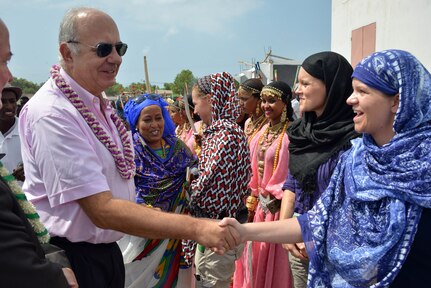 Tadjoura, Djibouti – Staff Sgt. Amanda P. Junkans, a human resources non-commissioned officer and civil affairs female initiative team member with the 418th Civil Affairs Battalion, welcomes Francisco Jose Puig Vara, a head of cooperation first counsellor with the European Union, to an eradication of female genital mutilation conference here on October 26, 2016.  Civil Affairs Soldiers with the female initiative group took part in key leader engagements with local leaders and government officials in order to discuss human capacity building projects. 
(US Army Photo By Staff Sgt. Gregory Williams C/Co 411th Civil Affairs Battalion)
