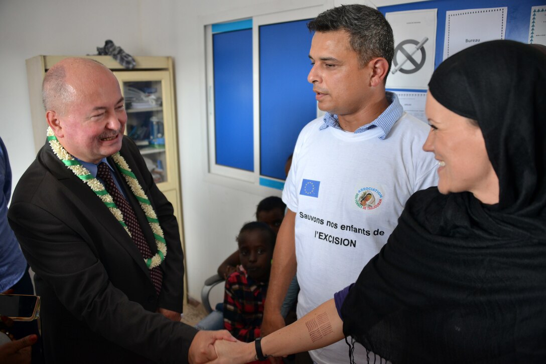 Tadjoura, Djibouti – Capt. Hallie Carter, operations officer and civil affairs female initiative team member with the 418th Civil Affairs Battalion, and Maj. Andres Gil, commander of C/Co 411th Civil Affairs Battalion discuss future human capacity building projects with Ambassador Adam Kulach, a head of delegation with the European Union, during a eradication of female genital mutilation conference here on October 26, 2016.  Civil Affairs Soldiers met with local leaders and foreign dignitaries in order to discuss future involvement with FGM workshops in order to enhance U.S.-Djiboutian relations.
(US Army Photo By Staff Sgt. Gregory Williams C/Co 411th Civil Affairs Battalion)