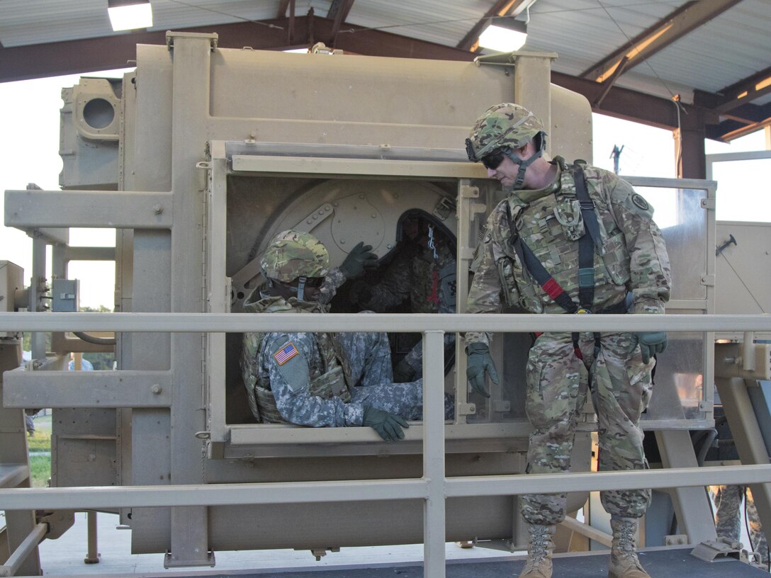 Soldiers of the 316th Sustainment Command (Expeditionary) egress from a humvee egress assistance trainer (HEAT) at Fort Hood, Tx., Oct. 26, 2016. (U.S. Army photo by Staff Sgt. Dalton Smith)