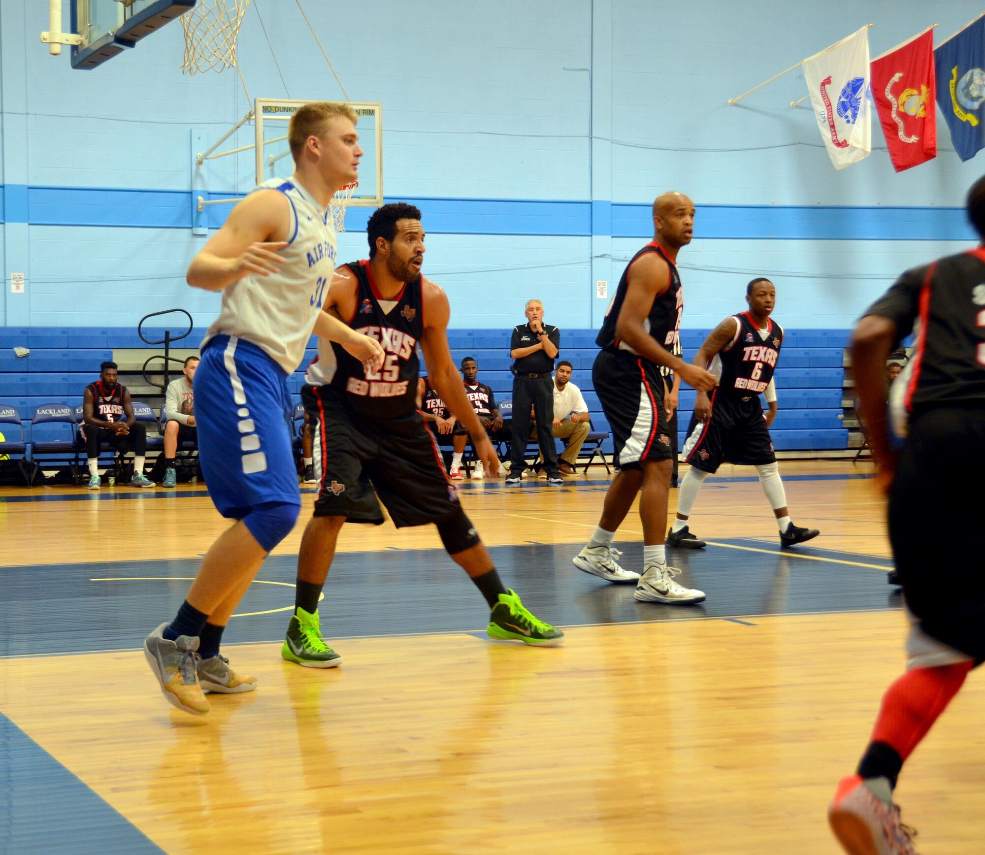 1st Lt. Chase Kammerer, Air Force Research Lab Munitions Directorate, defends the Texas Red Wolves’ Monwell Randle during the first half  of a scrimmage game at the Chaparral Fitness Center at JBSA-Lackland, Texas. Krammerer made the All-Air Force men's basketball team who will play in the all-service tournament Oct. 31- Nov. 8. (U.S. Air Force photo/ Steve Warns)

  