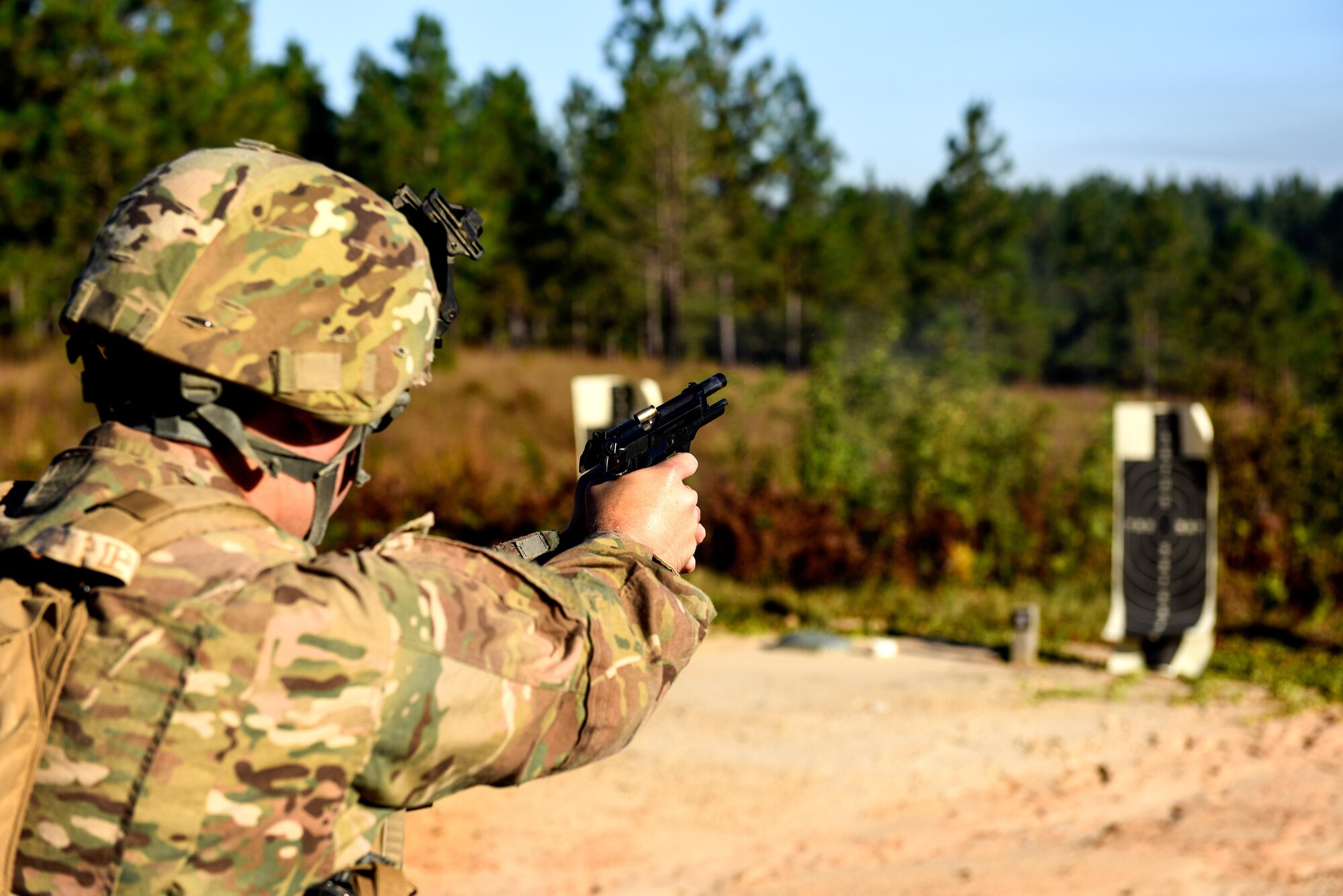 Senior Airman Parker White, a combat arms training and maintenance instructor with the 1st Special Operations Security Forces Squadron, fires an M9 pistol during Task Force Exercise Southern Strike at Camp Shelby, Miss., Oct 23, 2016. Air Commandos received in-depth weapons training from combat arms training and maintenance instructors with the 1st SOSFS. (U.S. Air Force photo by Senior Airman Jeff Parkinson)