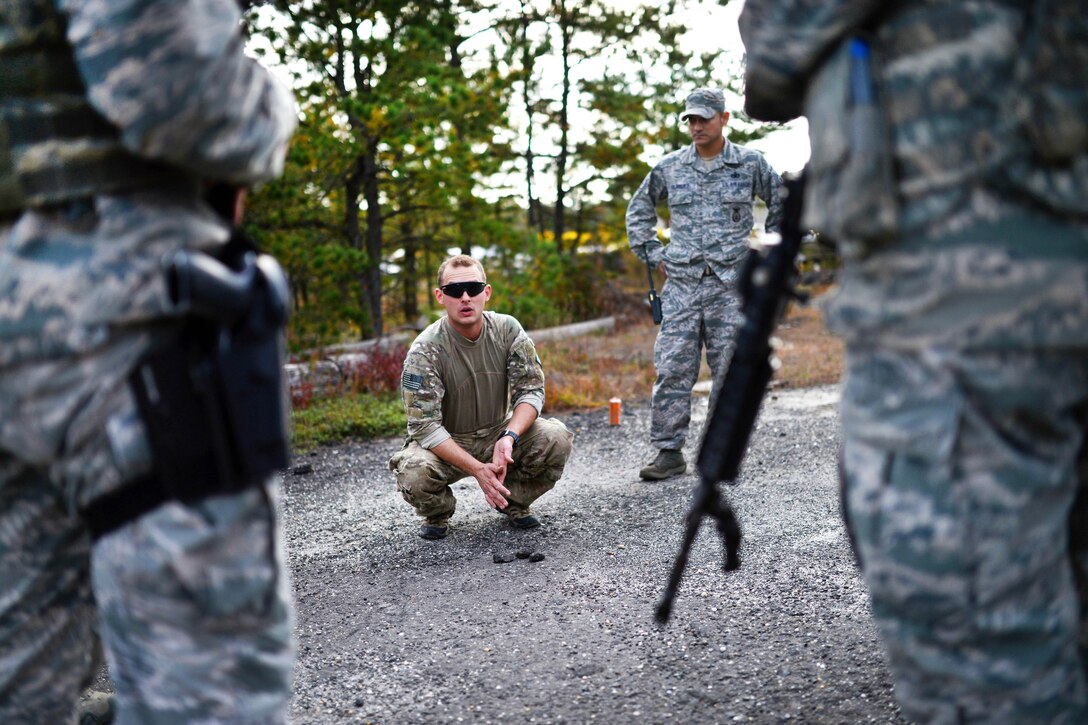 Air Force Staff Sgt. Joseph Pico, center, conducts tactical combat casualty care training with airmen at Francis S. Gabreski Airport in Westhampton Beach, N.Y., Oct. 21, 2016. Pico is a combat arms training and maintenance instructor. Air National Guard photo by Staff Sgt. Christopher S. Muncy