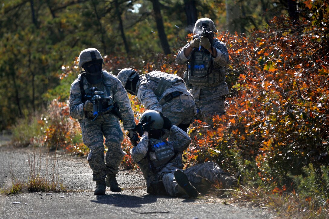 Airmen drag a simulated casualty to safety during tactical combat casualty care training at Francis S. Gabreski Airport in Westhampton Beach, N.Y., Oct. 21, 2016. Air National Guard photo by Staff Sgt. Christopher S. Muncy
