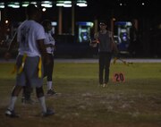 2nd Logistics Readiness Squadron football team are just short of the first down line after the catch and run by their wide receiver at Barksdale Air Force Base, La., Oct. 25, 2016. If a team scores a touchdown, they have the opportunity to get an extra point, or two extra points. (U.S. Air Force photo/Airman 1st Class Stuart Bright)