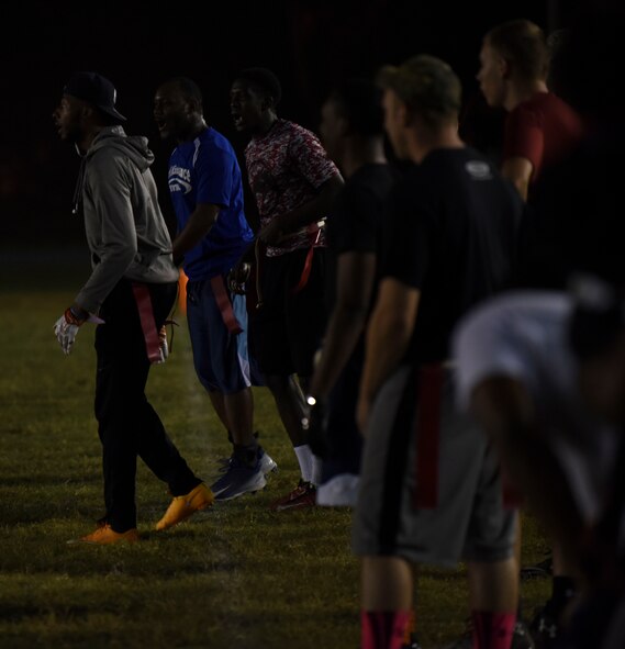 The 2nd Maintenance Squadron football team, cheer as they gain a first down at Barksdale Air Force Base, La., Oct. 25, 2016. This was the second pre-season game for both the 2MXS and the 2nd Logistics Readiness Squadron football team. (U.S. Air Force photo/Airman 1st Class Stuart Bright)