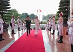 Vietnam People’s Army, Chief of the General Staff and Deputy Minister of National Defense, Lt. Gen. Phan Van Giang, left, and Adm. Harry Harris Jr., commander of U.S. Pacific Command, render honors during honor ceremony at the Ministry of National Defense, Oct. 26, 2016.