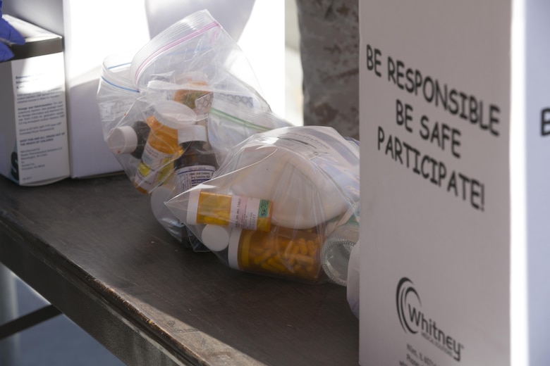 A package of medication is dropped off during the Provost Marshal’s Office Drug Take Back at Heritage Park, aboard Marine Corps Air Cround Combat Center Twentynine Palms, Calif., Oct. 22, 2016. The take back is held to give the Combat Center community the opportunity to anonymously turn in any expired or unneeded prescription drugs for proper disposal. (Official Marine Corps photo by Cpl. Thomas Mudd/Released)