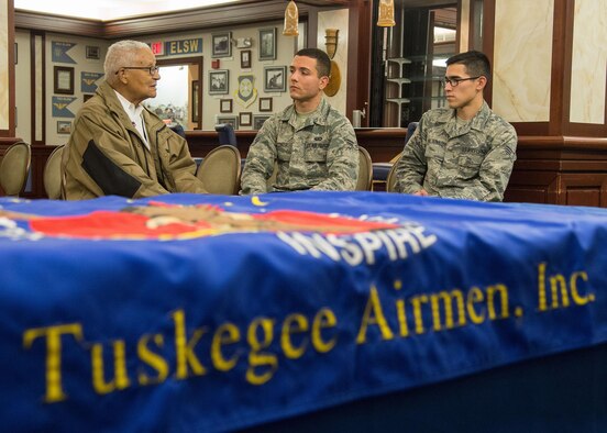 Retired Col. Charles E. McGee, an original Tuskegee Airman, speaks with Senior Airman Alfredo Maldonado, right, and Airman 1st Class Quinton Coke, both personnelist with the 66th Force Support Squadron, during a visit to Hanscom Air Force Base, Mass., Oct. 27. McGee met with Airmen prior to speaking at an event in Boston co-hosted by the New England Tuskegee Airmen Chapter and the local chapter bearing his name. (U.S. Air Force photo by Mark Herlihy)   