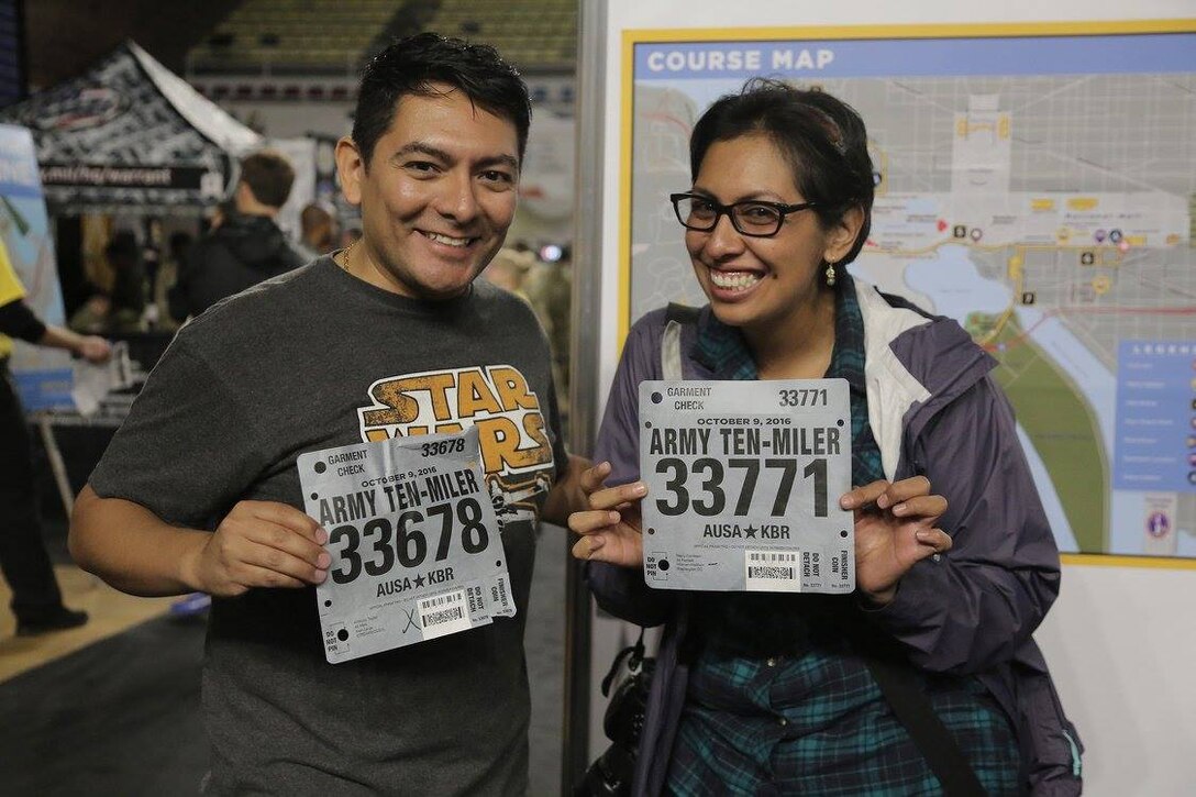 Master Sgt. Anthony L. Taylor, left, and Staff Sgt. Nazly Confessor, both assigned to First Army, pause for a photo with their run bibs prior to the Army Ten-Miler race in Washington D.C., Oct. 8, 2016. The race that took place on October 9, 2016 had more than 30,000 runners participating.
(Courtesy photo)