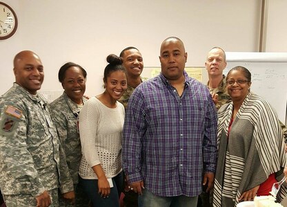 Ms. Shatondrea Cox, 3rd from left, Budget Analyst, 85th Support Command, pauses for a photo with the command's full time staff members during a farewell reception for Cox.
(Courtesy photo)