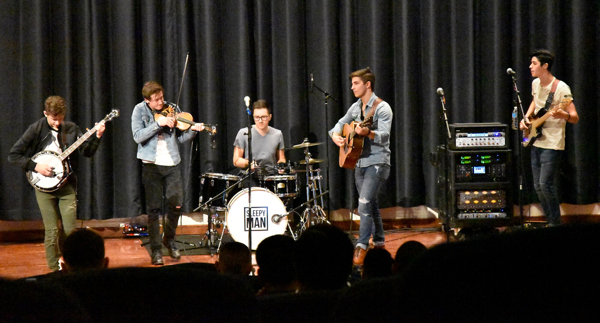 Sleepy Man, a band featuring young bluegrass artists, was one-of-two musical talents that performed Tuesday during the TEDx event held at the Expeditonary Center, here. The independently organized event highlighted speakers, entertainers and video presentations that gave attendees ideas on how they can make self, work, family, community and global changes. (Photo/Sherry Jacobs)
