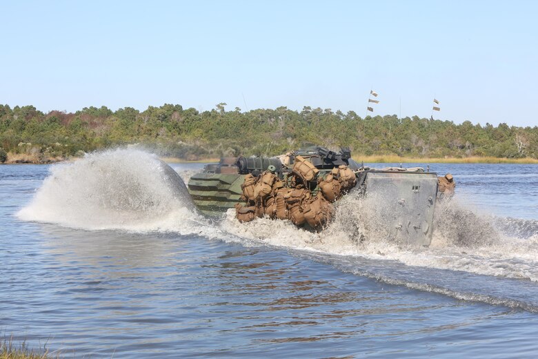 An amphibious assault vehicle carrying Marines with 3rd Battalion, 8th Marine Regiment traverses through water before conducting a simulated sea-to-shore attack at Camp Lejeune, N.C., Oct. 24, 2016. Marines with 3rd Bn., 8th Marines, tested their warfighting abilities and combat readiness through a Marine Corps Combat Readiness Evaluation in preparation for an upcoming deployment. (U.S. Marine Corps photo by Sgt. Clemente C. Garcia)