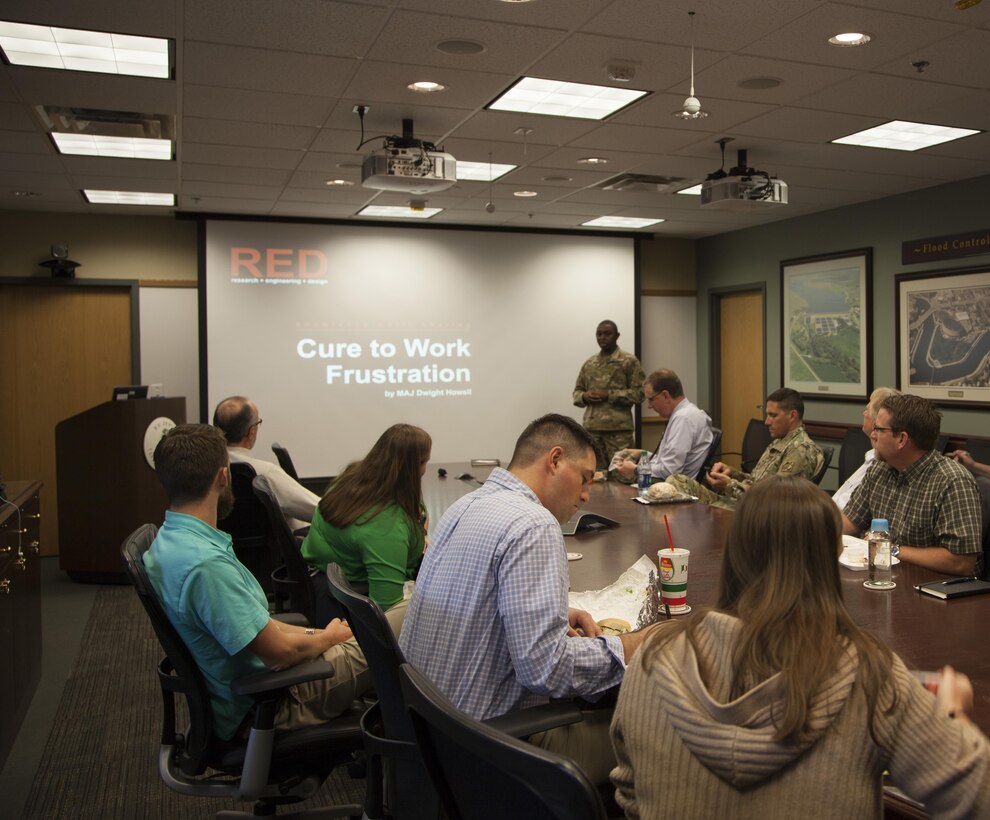 Maj. Dwight Howell, St. Paul District quality and knowledge manager, presents the inaugural RED talk at the district's headquarters in St. Paul, Minn., Oct. 19. The RED talks, short for research, engineering and design, are designed to create a culture of sharing information within the organization. 