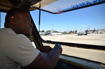 Staff Sgt. Malcolm Young, 94th Aircraft Maintenance Squadron hydraulics specialist, drives on the flight line to one of the parked C-130 aircraft at Dobbins Air Reserve Base, Georgia on September, 29, 2016. Young's hydraulic work keeps the planes in the air so pilots can fly their missions and save lives. (U.S. Air Force photo by Senior Airman Lauren Douglas) 