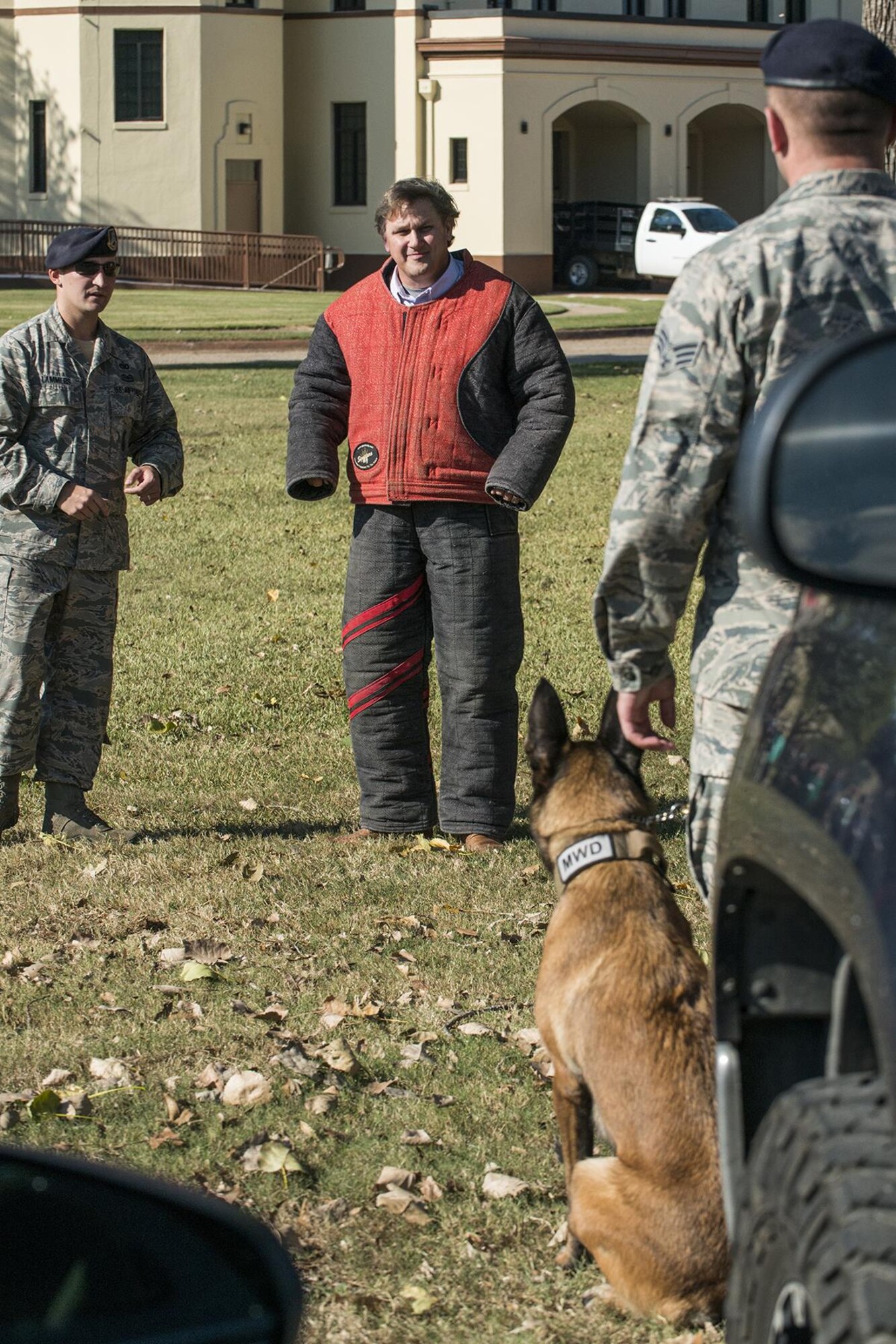 A member of a civic leader group is about to experience the takedown power of a 2nd Security Forces Squadron working dog during a demonstration at Barksdale Air Force Base, La., Oct. 27, 2016. The tour was hosted by the 433rd Airlift Wing from Lackland Air Force Base, Texas, and travel to Barksdale to get first hand look at the different missions throughout the Air Force Reserve Command. (U.S. Air Force photo by Master Sgt. Greg Steele/Released)