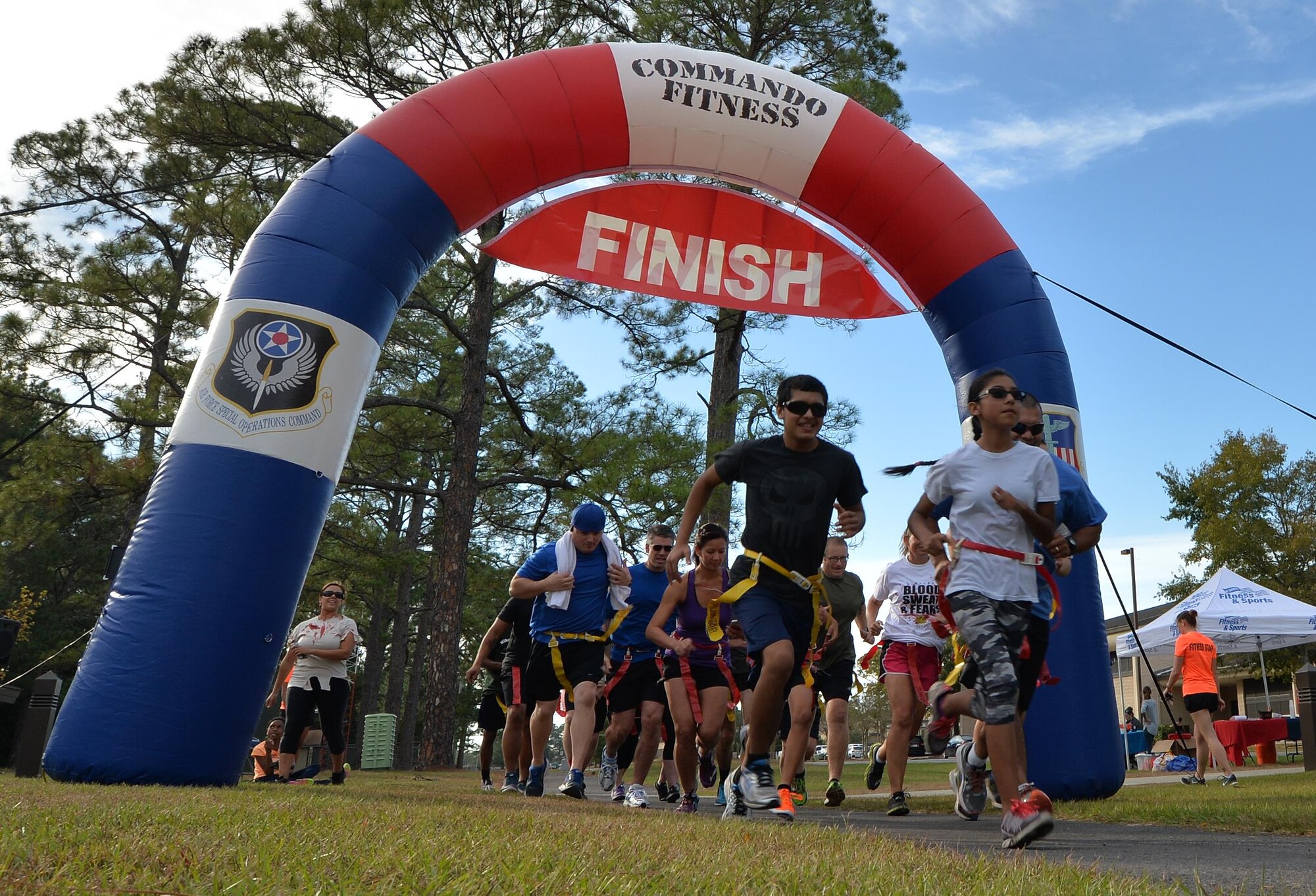 Air Commandos begin the Fear the Running Dead Race at Hurlburt Field, Fla., Oct. 27, 2016. During the race, runners were challenged to “survive the apocalypse” by avoiding zombified Airmen for close to 3.1 miles. (U.S. Air Force photo by Senior Airman Andrea Posey)
