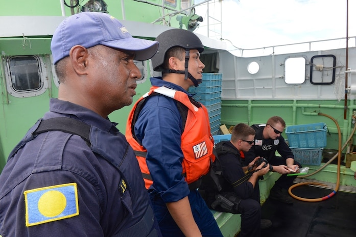 The Coast Guard, working with the Palau National Police, conducts fisheries enforcement boardings in the Palau exclusive economic zone under a bilateral agreement. (U.S. Coast Guard photo by Chief Petty Officer Sara Mooers)