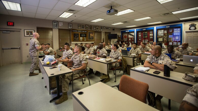 A Force Fitness Instructor (FFI) Trainer instructs a class of FFI students during their class room portion of the course at Marine Corps Base Quantico, Virginia, October 25, 2016. The students receive formal instruction on nutrition, sports medicine and anatomy during the five week course in addition to physical training and practical application. Upon completion, the Marines will serve as unit FFIs, capable of designing individual and unit-level holistic fitness programs.  
