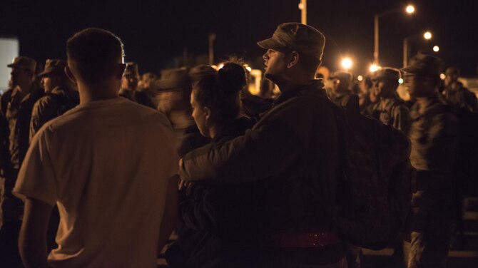 An airman waits with his significant other before boarding a bus to deploy with the 389th Fighter Squadron, Sept. 30, 2016, at Mountain Home AFB, Idaho. Hundreds of Gunfighters have deployed over the past two years in support of Operation Inherent Resolve. (U.S. Air Force photo by Senior Airman Jeremy L Mosier/Released)