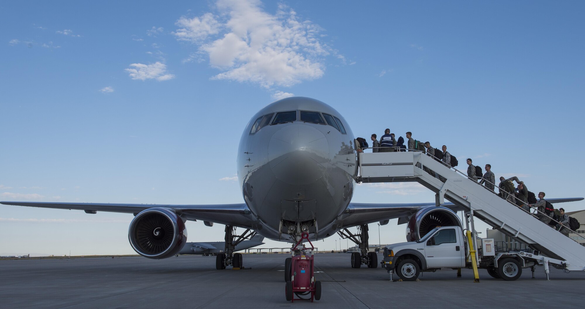 366th Fighter Wing personnel board an aircraft for a deployment to Southwest Asia in support of Operation Inherent Resolve, Sept. 30, 2016, at Mountain Home AFB, Idaho. Personnel across base worked together to ensure everything was ready for the deployment. (U.S. Air Force photo by Senior Airman Jeremy L Mosier/Released)