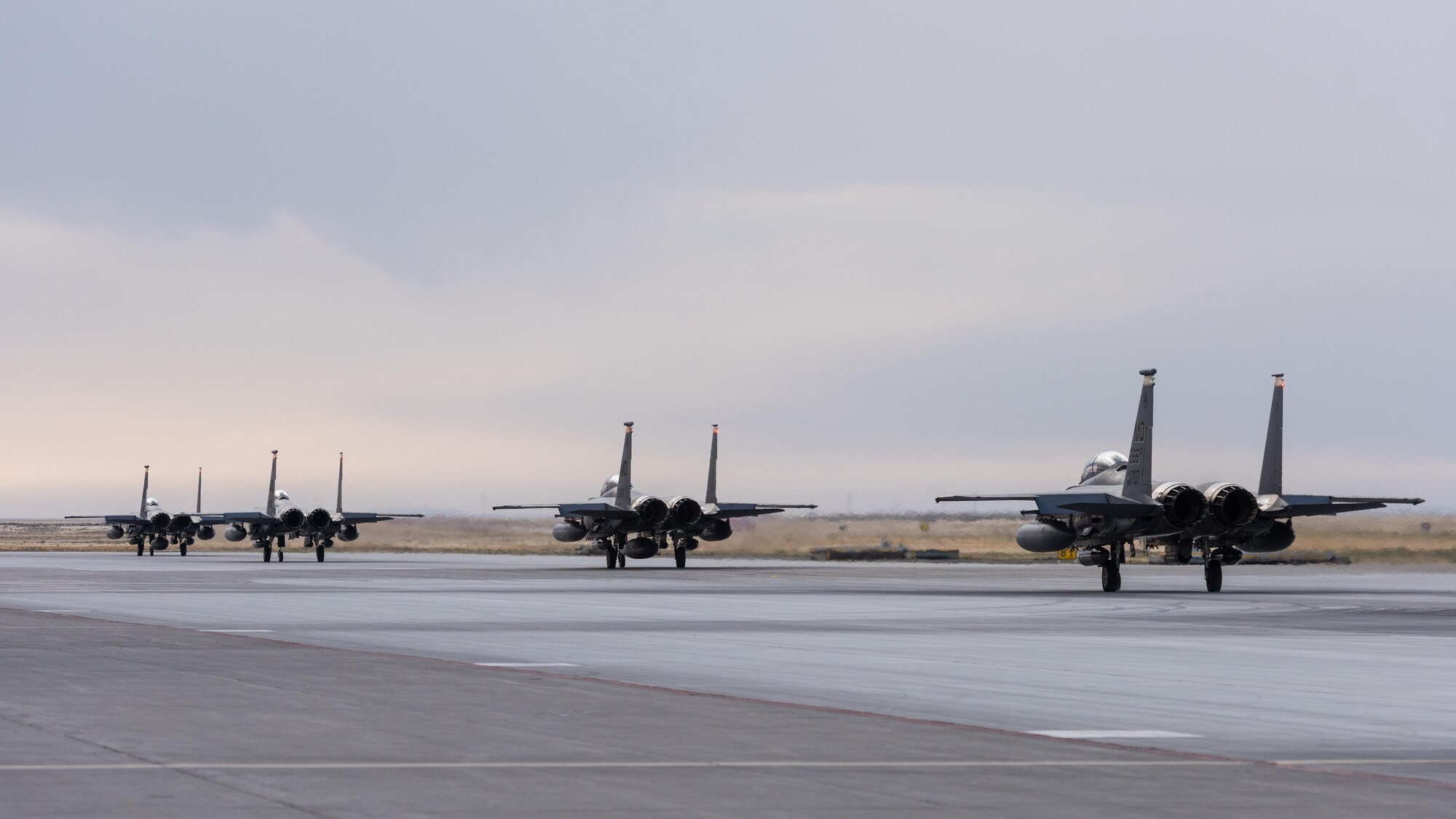 F-15E Strike Eagles taxi down the runway as they prepare to depart to Southwest Asia in support of Operation Inherent Resolve, Oct. 1, 2016, at Mountain Home Air Force Base, Idaho. Hundreds of Gunfighters have deployed in support combat operations across the globe.(U.S. Air Force photo by Senior Airman Connor J. Marth/Released)