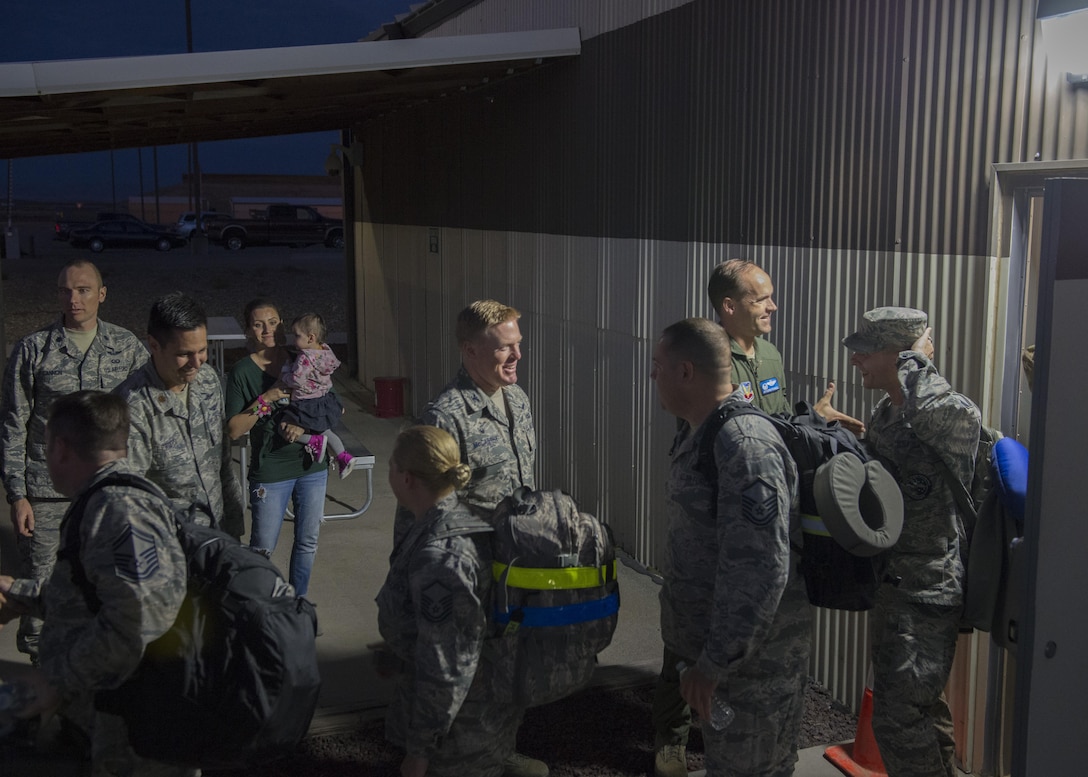 366th Fighter Wing leaders shake hands with members of the 726th Air Control Squadron before departing Mountain Home Air Force Base, Idaho for a deployment Oct.10, 2016. The 726th ACS members deployed to support operations in Southwest Asia. (U.S. Air Force photo by Airman 1st Class Chester Mientkiewicz/Released)