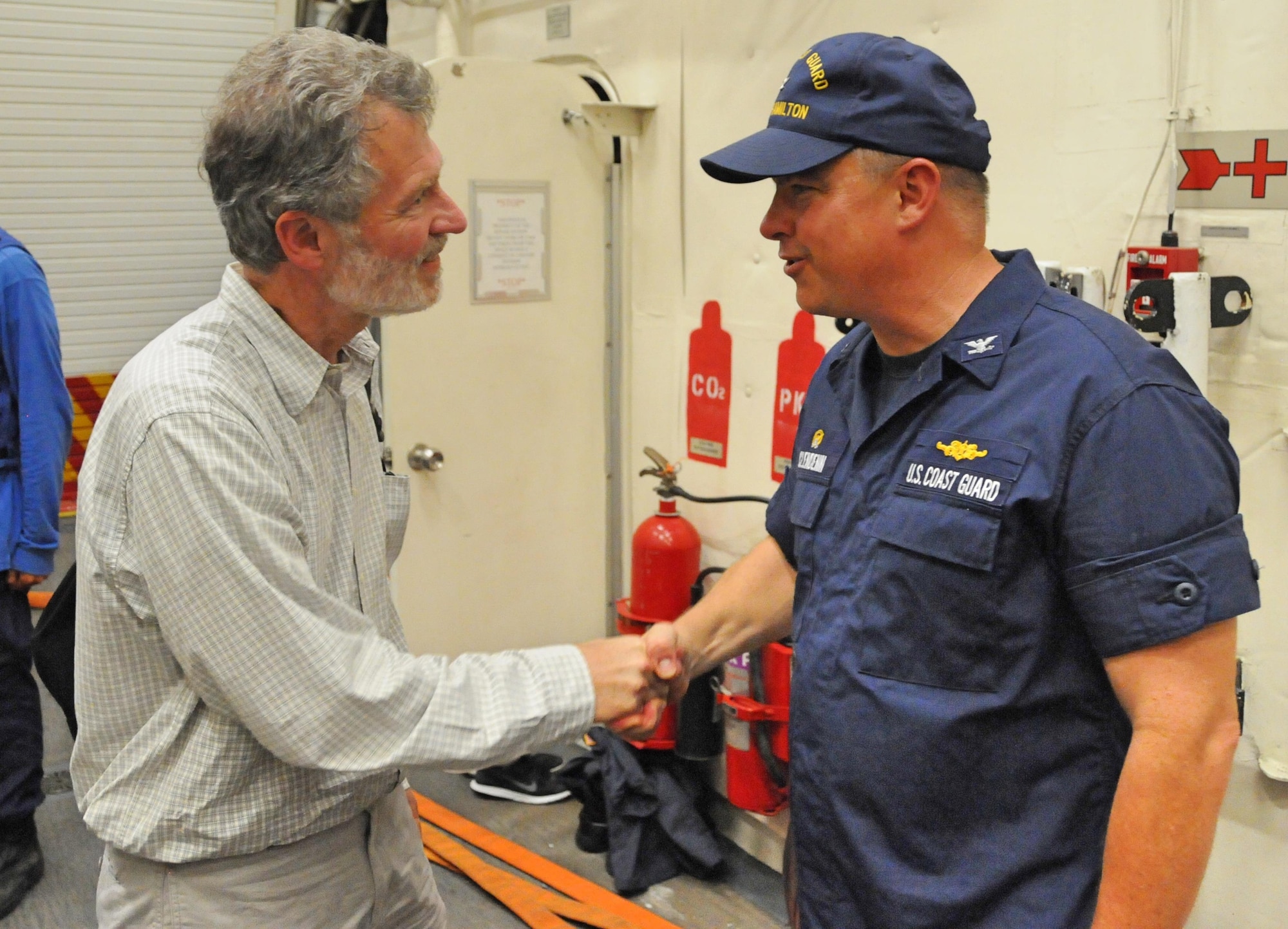 U.S. Coast Guard Capt. Scott Clendenin, USCGC Hamilton (WMSL 753) commander, welcomes the U.S. Ambassador to the Republic of Haiti, the Honorable Peter Mulrean, aboard the U.S. Cutter Hamilton off the coast of Jeremie, Haiti, on Oct. 8, 2016. (U.S. Coast Guard Photo by Petty Officer First-Class Joseph Cook)