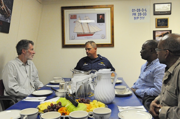 U.S. Coast Guard Capt. Scott Clendenin, USCGC Hamilton (WMSL 753) commander, meets with Jocelerme Privert, President of the Republic of Haiti, Peter Mulrean, U.S. Ambassador to Haiti and Leopold Berlanger, President of Haiti’s Provisional Electoral Council, aboard the Hamilton off the coast of Jeremie, Haiti, Oct. 8, 2016 (U.S. Coast Guard Photo by Petty Officer First-Class Joseph Cook)