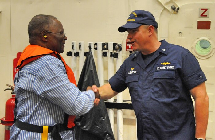 U.S. Coast Guard Capt. Scott Clendenin, U.S. Coast Guard cutter Hamilton (WMSL 753) commander, welcomes Jocelerme Privert, President of the Republic of Haiti, onboard the Hamilton off the coast of Jeremie, Haiti, Oct. 8, 2016.