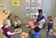 Yolonda Green, education technician, entertains children with a puppet during play time at the Joint Base Charleston Child Development Center, Oct. 24, 2016. The CDC provides daytime care for children of Department of Defense members from six months to five years of age.