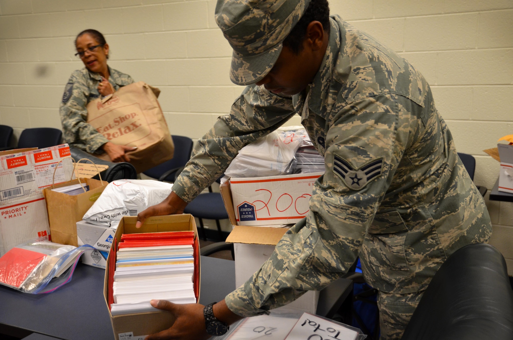 Senior Airman Justin Holt, 94th AW Aircraft Maintenance Squadron specialist, and other Airmen from the 94 Airlift wing came to help unload and receive the generous donation of holiday cards for deployed troops on October 25, 2016 at Dobbins Air Reserve Base, Georgia. The Eastern Stars gave over 10,000 cards to be sent to troops that may not be in the company of family this holiday. (U.S. Air Force photo by Senior Airman Lauren Douglas)