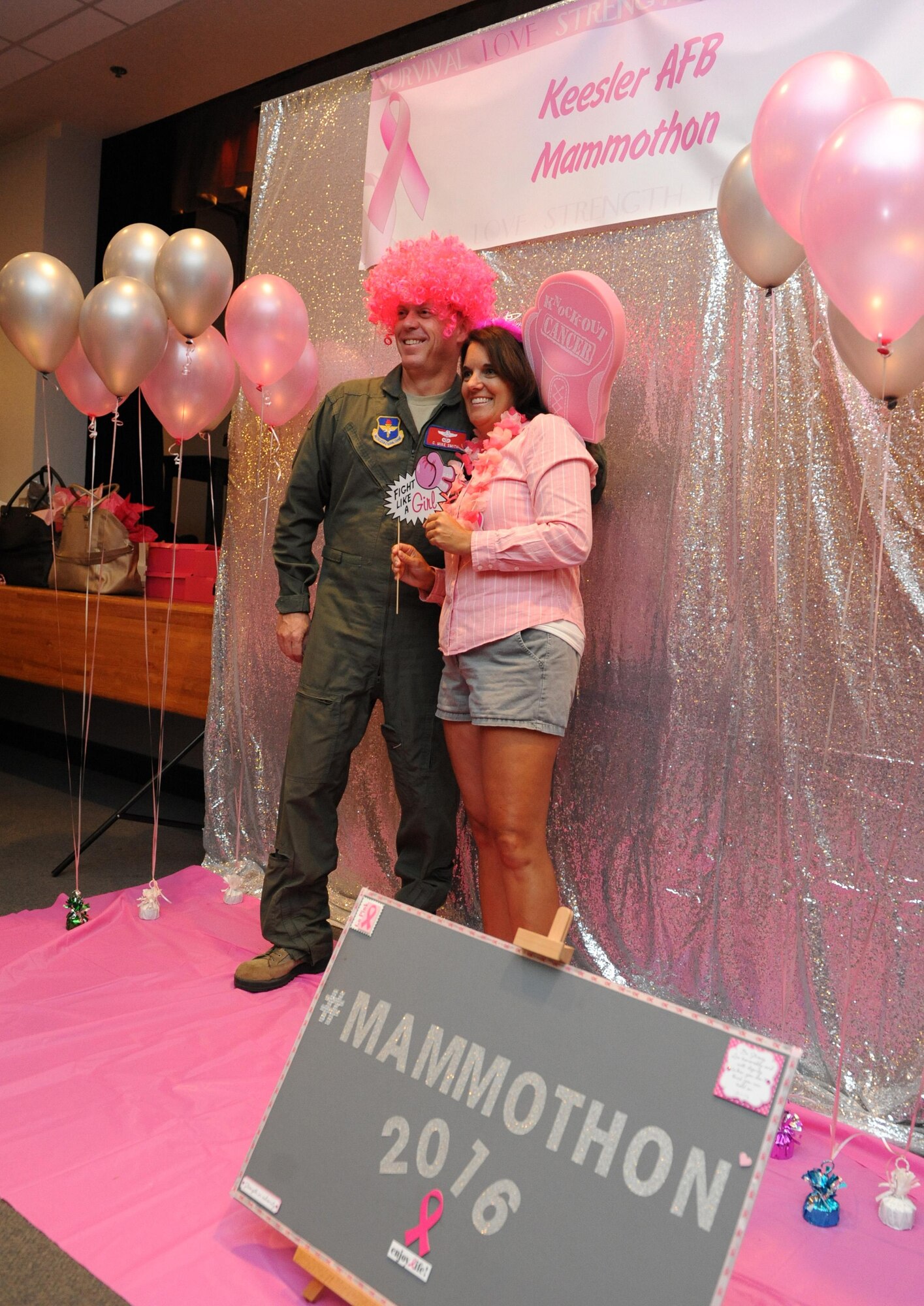 Col. C. Mike Smith, 81st Training Wing vice commander, and his wife, Kristi, pose for a photo during the 5th Annual Mammothon Cancer Screening and Preventative Health Fair at the Don Wylie Auditorium Oct. 28, 2016, on Keesler Air Force Base, Miss. The walk-in event included screenings for multiple types of cancer and chronic diseases in honor of Breast Cancer Awareness Month. Flu shots were also provided upon request. (U.S. Air Force photo by Kemberly Groue/Released)