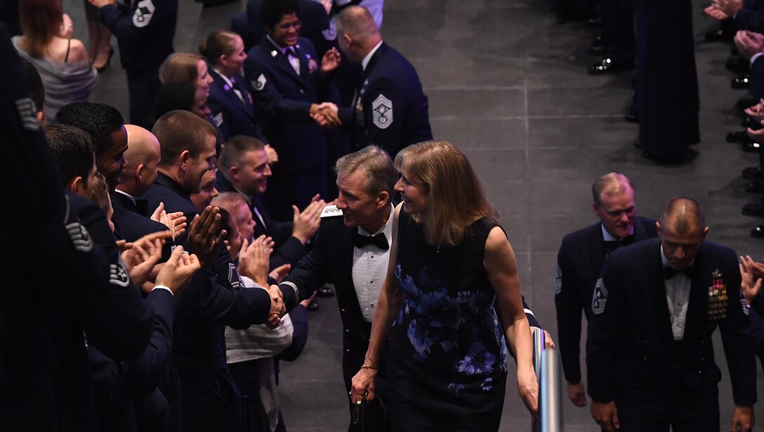 Gen. Hawk Carlisle, commander of Air Combat Command, is congratulated by Airmen as he walks up the stairs with his wife, Gillian Carlisle, before being honored during Order of the Sword Ceremony at the Hampton Roads Convention Center in Hampton, Va., Oct. 27, 2016. The Order of the Sword is the highest honor and tribute enlisted Airmen can bestow upon a commissioned officer. It is patterned after two orders of chivalry founded during the Middle Ages in Europe and still in existence today - the Royal Order of the Sword and the Swedish Military Order of the Sword. (U.S. Air Force photo by Staff Sgt. Nick Wilson)