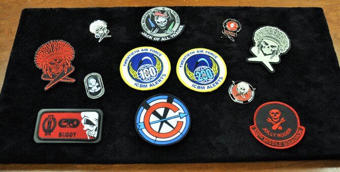 320th Missile Squadron missile combat crew commander, 1st Lt. Raun Carnley,  products sit on display at F.E. Warren Air Force Base, Wyo., Oct. 27, 2016. Carnley designs items believing these symbolic keepsakes stimulate better attitudes, morale and commitment to the mission.