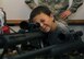 A child looks through the scope of a rifle during a weapons display as part of National Crime Prevention Month at Ellsworth Air Force Base, S.D., Oct .12, 2016. The 28th Security Forces Squadron will be holding a raffle to offer children on base the chance to participate in a "Cop for a Day" event from Nov. 24 to 28, where the winner will get to ride-along with 28th SFS personnel. (U.S. Air Force photo by Airman 1st Class Denise M. Jenson) 
