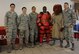 Members from the 28th Security Forces Squadron pose for a photo with McGruff the Crime Dog during a Red Suit demonstration at Ellsworth Air Force Base, S.D., Oct. 12, 2016. The 28th SFS celebrated National Crime Prevention Month as a way to educate families about protecting themselves from being a victim of any crime. (U.S. Air Force photo by Airman 1st Class Denise M. Jenson)