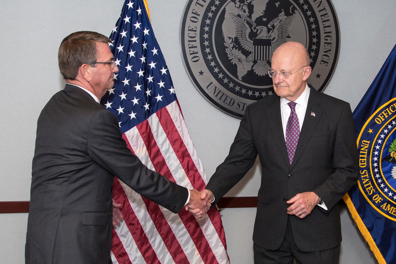 Defense Secretary Ash Carter congratulates James R. Clapper, the director of the Office of National Intelligence, during an award ceremony at the office’s headquarters in Tysons Corner, Va., Oct. 28, 2016. Carter presented Clapper with the Distinguished Civilian Service Medal, the Defense Department’s highest award. Office of the Director of National Intelligence photo 