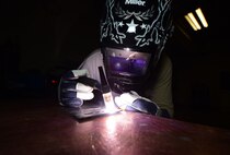 Senior Airman Kyle Eberhart, an aircraft metals technology journeyman assigned to the 28th Maintenance Squadron, practices his welding with a tungsten inert gas welder at Ellsworth Air Force Base, S.D., Oct. 27, 2016. With the numerous types of parts that may need to be created or repaired, metals tech Airmen must remain proficient with all of the equipment in their shop. (U.S. Air Force photo by Airman 1st Class James L. Miller)