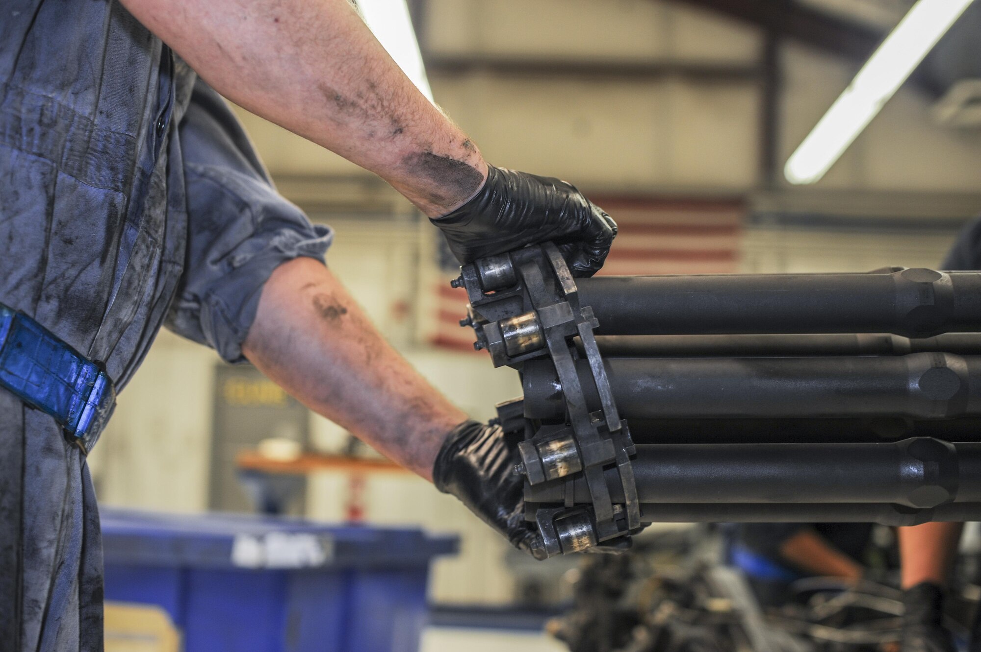 U.S. Air Force Airman 1st Class Joel Balmforth, 355th Aircraft Maintenance Squadron armament member, removes the mid-barrel support assembly from a GAU-8/A Gatling gun for cleaning and inspection at Davis-Monthan Air Force Base, Ariz., Oct. 24, 2016. The first in-flight testing of the weapon system took place on Feb. 26, 1974. (U.S. Air Force photo by Airman 1st Class Ashley N. Steffen) 