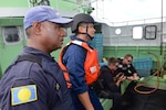 The Coast Guard, working with the Palau National Police, conducts fisheries enforcement boardings in the Palau exclusive economic zone under a bilateral agreement. (U.S. Coast Guard photo by Chief Petty Officer Sara Mooers)