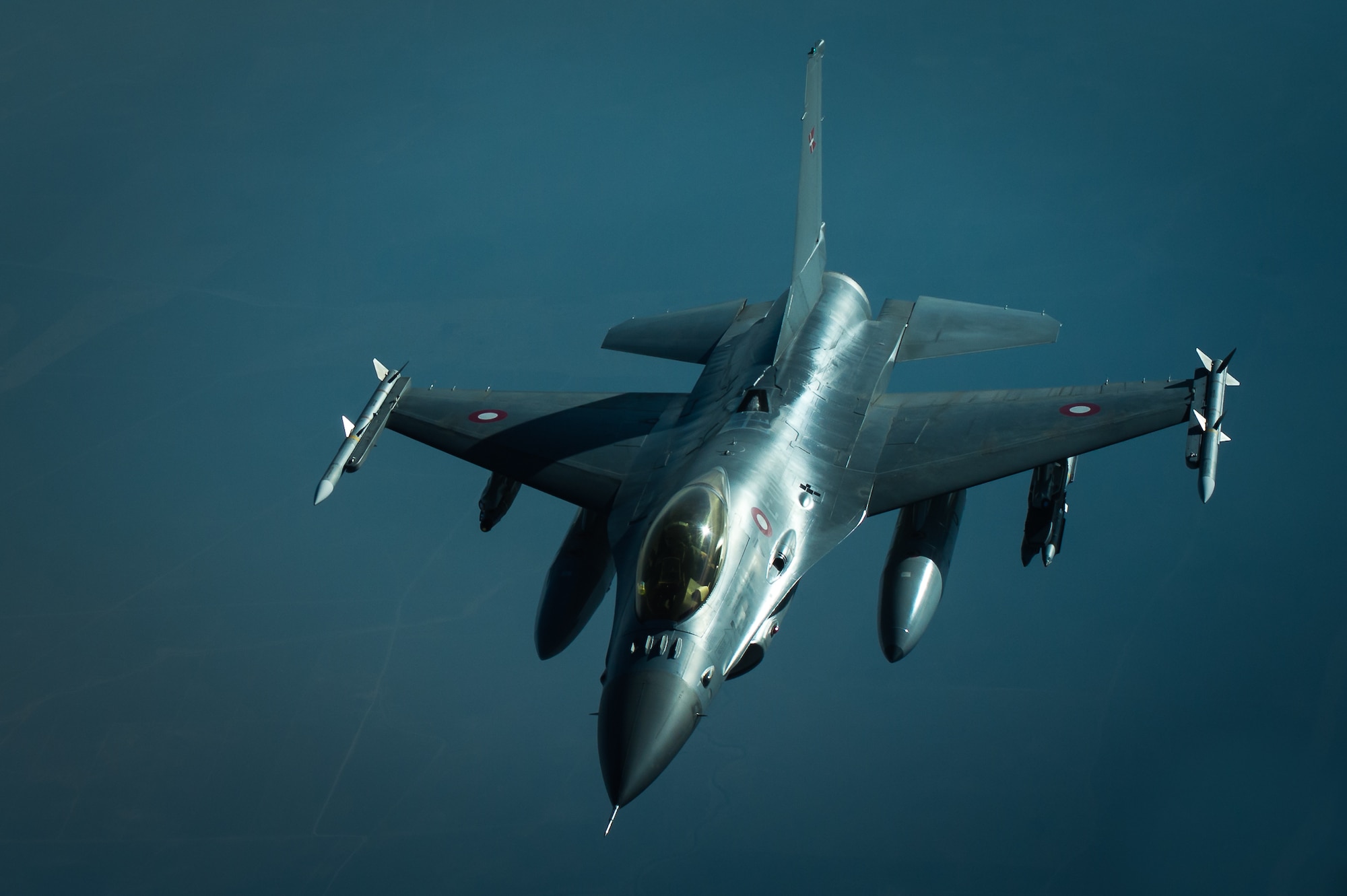 A Royal Danish air force F-16 separates from a KC-10 after refueling near Iraq, Oct. 26, 2016. The RDAF F-16s are providing close air support with several other coalition airframes working to liberate the city of Mosul, Iraq. (U.S. Air Force photo by Senior Airman Tyler Woodward)