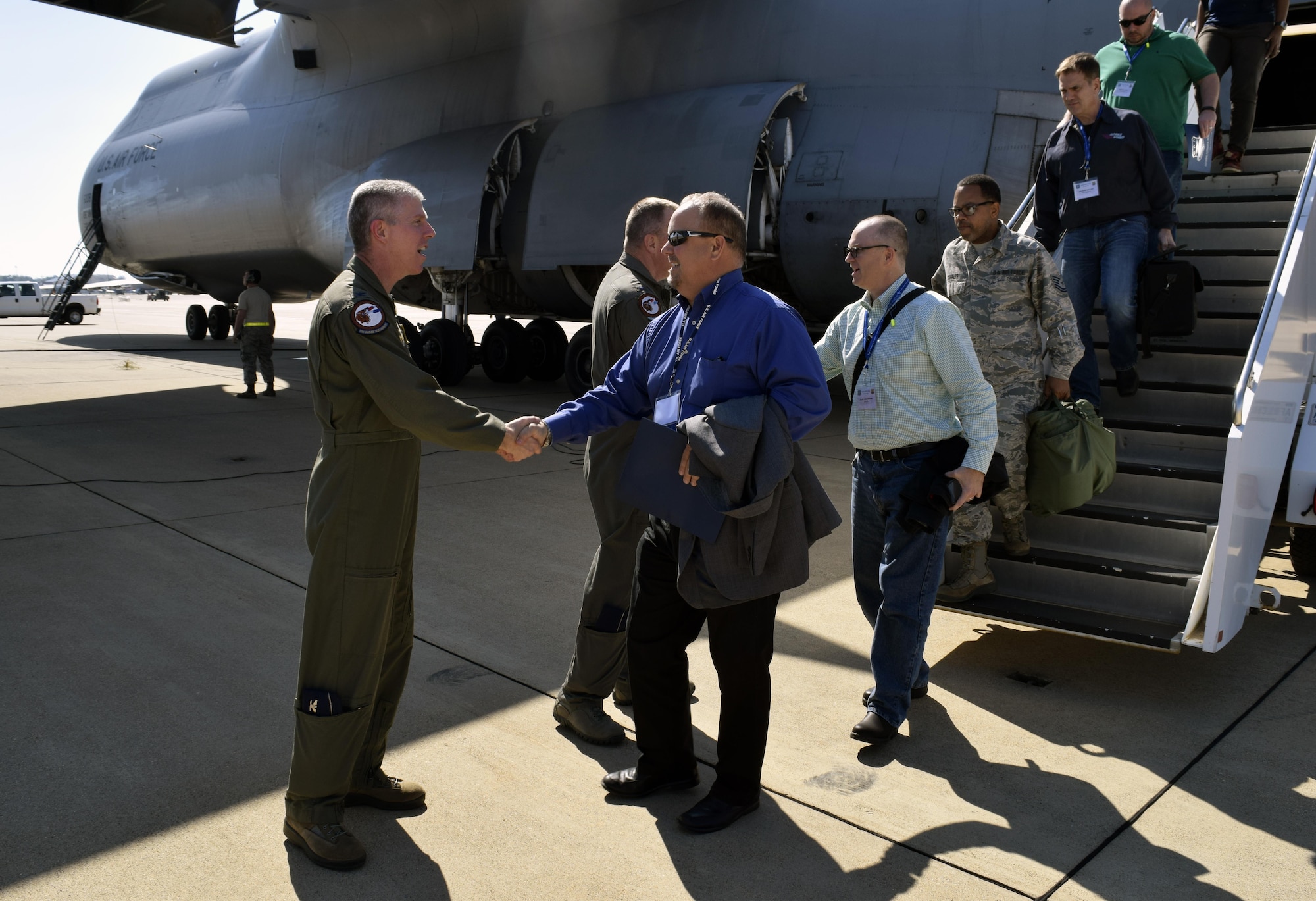 Col. James L. Morriss III, right, 307th Bomb Wing vice commander, welcomes Texas civic leaders and 433rd Airlift Wing members to Barksdale Air Force Base, La., Oct. 27, 2016 as they begin a two-day tour of the base. During their visit, community leaders toured the B-52 Stratofortress, flew in the aircraft’s simulator, and saw demonstrations by the military working dogs, explosive ordnance and life support flights. (U.S. Air Force photo by Tech. Sgt. Lindsey Maurice)