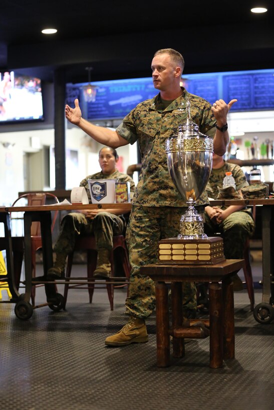 Col. Todd Ferry addresses Marines and Sailors before awarding the prestigious intramural sports trophy to Naval Health Clinic Cherry Point aboard Marine Corps Air Station Cherry Point, N.C., Oct. 27, 2016. Cherry Point’s Semper Fit program annually re-awards the trophy to the unit aboard the air station that wins the most championships throughout the year. Some of the sports they participated in include softball, basketball, football and soccer. Ferry is the MCAS Cherry Point commanding officer. (U.S. Marine Corps photo by Lance Cpl. Mackenzie Gibson/Released)